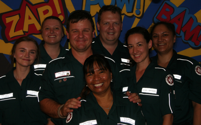 A group of ambulance officers smiling for the camera